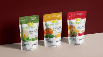 Three colorful pouches of EssentialCandy Hard Candy in various botanical flavors.