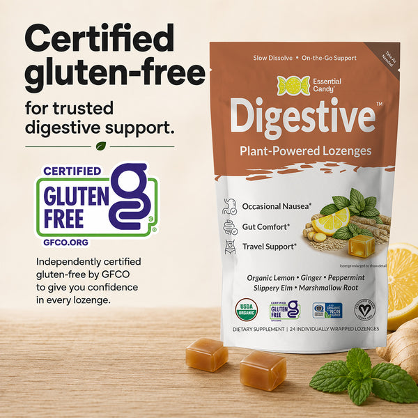 A stand-up pouch of Essential Candy Digestive Plant-Powered Lozenges is shown on a light wood surface with loose caramel cubes, mint leaves, and sliced orange. Large text reads 'Certified gluten-free for trusted digestive support,' with a visible Certified Gluten Free logo.