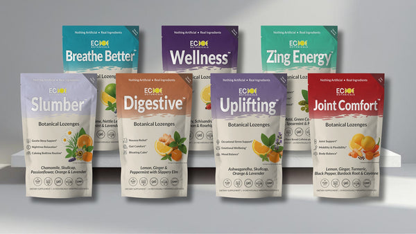 Essential Candy Botanical lozenge packages on a gray background