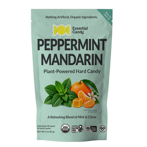A 3 oz stand-up pouch of Essential Candy Peppermint Mandarin plant-powered hard candy, featuring a mint green background with illustrations of mint leaves, a mandarin orange, and candy pieces.